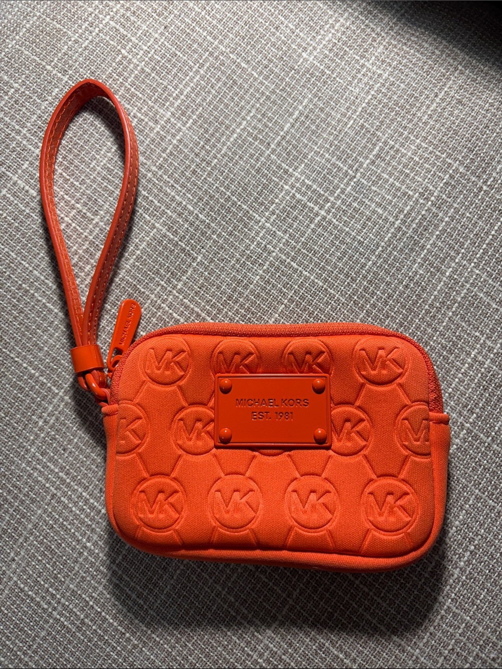 Michael Kors Orange Embossed Logo Wristlet Pouch